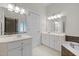 Bathroom featuring double sinks, white cabinetry, and separate tub and shower at 5108 Briton Pl, Fuquay Varina, NC 27526
