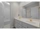 Bathroom features a double sink vanity, large mirror, and a door leading to the tub at 5108 Briton Pl, Fuquay Varina, NC 27526