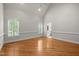 Bright primary bedroom with two large windows and ensuite bathroom access at 5108 Briton Pl, Fuquay Varina, NC 27526