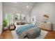 Spacious bedroom with vaulted ceiling, soft lighting, and ensuite bathroom access at 5108 Briton Pl, Fuquay Varina, NC 27526