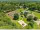 Aerial view of community tennis courts, swimming pool and playground at 5108 Briton Pl, Fuquay Varina, NC 27526
