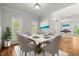 Elegant dining room featuring a marble table, stylish chairs, and modern decor at 5108 Briton Pl, Fuquay Varina, NC 27526