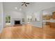 Empty living room with fireplace, hardwood floors, and natural light from windows at 5108 Briton Pl, Fuquay Varina, NC 27526