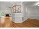 Open-concept living room with hardwood floors, fireplace, and staircase at 5108 Briton Pl, Fuquay Varina, NC 27526