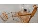 View from staircase to fireplace and hardwood floors in a spacious living room at 5108 Briton Pl, Fuquay Varina, NC 27526