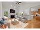 Spacious living room with fireplace, hardwood floors, and open access to kitchen at 5108 Briton Pl, Fuquay Varina, NC 27526