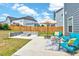Cozy backyard featuring a fire pit and outdoor seating area perfect for entertaining and relaxation at 512 Teal Lake Dr, Holly Springs, NC 27540