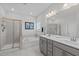 A stunning bathroom featuring a shower, soaking tub and dual sink vanity providing a relaxing and functional space at 512 Teal Lake Dr, Holly Springs, NC 27540