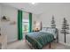 Bedroom featuring a comfortable bed, decor, and natural light creating a cozy and inviting atmosphere at 512 Teal Lake Dr, Holly Springs, NC 27540