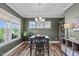 Elegant dining room with neutral walls, decorative trim, hardwood floors, and large window at 512 Teal Lake Dr, Holly Springs, NC 27540
