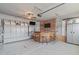A garage has been converted to an entertainment space with a bar and chairs providing a unique gathering space at 512 Teal Lake Dr, Holly Springs, NC 27540