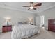 Spacious main bedroom featuring tray ceilings, soft lighting, and a comfortable bed, creating a relaxing retreat at 512 Teal Lake Dr, Holly Springs, NC 27540