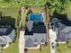 Aerial view of the property showcasing a backyard oasis with pool, patio, and manicured landscaping at 517 Myrna Ln, Wake Forest, NC 27587