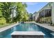 A large, in-ground pool anchors this lush backyard, offering a perfect oasis for relaxation and recreation at 517 Myrna Ln, Wake Forest, NC 27587