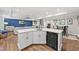Spacious basement features a kitchenette with white cabinetry and an expansive entertainment area at 517 Myrna Ln, Wake Forest, NC 27587
