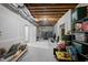 Unfinished basement with door, exercise equipment, concrete walls, and space for storage at 517 Myrna Ln, Wake Forest, NC 27587