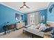 Comfortable bedroom with blue walls, a ceiling fan, and bright, natural lighting at 517 Myrna Ln, Wake Forest, NC 27587