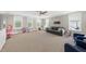 Spacious bonus room featuring neutral paint, multiple windows, and comfortable seating at 517 Myrna Ln, Wake Forest, NC 27587