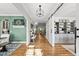 Inviting entryway featuring hardwood floors and stylish decor with an open floor plan at 517 Myrna Ln, Wake Forest, NC 27587