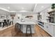 Basement kitchen area with a large island, bar stool seating, and modern appliances at 517 Myrna Ln, Wake Forest, NC 27587