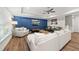 Cozy living room with a large sofa, recessed lighting, and modern decor at 517 Myrna Ln, Wake Forest, NC 27587