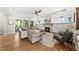 Cozy living room with fireplace, built-in shelves, and access to outdoor patio via sliding doors at 517 Myrna Ln, Wake Forest, NC 27587