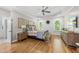 Tranquil main bedroom with tray ceiling, hardwood floors, and serene decor for ultimate relaxation at 517 Myrna Ln, Wake Forest, NC 27587