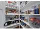 Organized walk-in pantry with ample shelving and clear storage containers for easy access at 517 Myrna Ln, Wake Forest, NC 27587