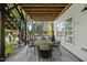 Outdoor patio with dining table, seating, and access to the backyard at 517 Myrna Ln, Wake Forest, NC 27587