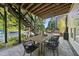 Outdoor patio with dining table, seating, and access to swimming pool at 517 Myrna Ln, Wake Forest, NC 27587