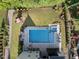 A backyard oasis showcasing a beautiful pool, spa, patio area, landscaping and playground at 517 Myrna Ln, Wake Forest, NC 27587