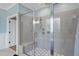 Modern tiled shower with glass enclosure and a built-in bench at 517 Myrna Ln, Wake Forest, NC 27587