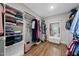 Organized walk-in closet with custom shelving and hardwood floors at 517 Myrna Ln, Wake Forest, NC 27587