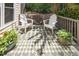 Cozy deck area with outdoor seating, creating a relaxing space to enjoy the natural surroundings at 5216 Sunset Fairways Dr, Holly Springs, NC 27540