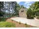 A spacious driveway leads to a well-maintained house with a garage, enhanced by a scenic lake view at 5216 Sunset Fairways Dr, Holly Springs, NC 27540