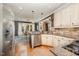 This kitchen features stainless steel appliances, granite countertops, and bright lighting at 5216 Sunset Fairways Dr, Holly Springs, NC 27540