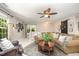 Relaxing living area with a comfortable sofa, decorative coffee table, and ample natural light at 5216 Sunset Fairways Dr, Holly Springs, NC 27540