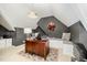 Home office with a large desk, built-in bench seating, and a unique light fixture at 5216 Sunset Fairways Dr, Holly Springs, NC 27540