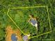 Aerial view highlighting the home's location surrounded by lush greenery and its approximate property line at 5300 Langdon Dr, Oxford, NC 27565