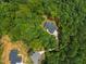 Overhead aerial view showcasing the home nestled among trees in a serene, natural setting at 5300 Langdon Dr, Oxford, NC 27565
