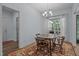 Bright dining area with a round wooden table, chandelier, and natural lighting at 5300 Langdon Dr, Oxford, NC 27565