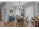 Cozy dining area featuring a traditional table set, natural light, and dark wooden accents at 5300 Langdon Dr, Oxford, NC 27565