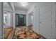 Inviting foyer with hardwood floors, decorative rug, and natural light at 5300 Langdon Dr, Oxford, NC 27565