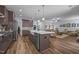 Open kitchen and living area with a large island, stainless steel appliances, and modern design at 5300 Langdon Dr, Oxford, NC 27565