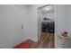 Functional laundry room with washer, dryer, and storage shelves by the entry door at 5300 Langdon Dr, Oxford, NC 27565
