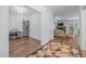 Open-concept living space with wood floors, fireplace, and neutral decor at 5300 Langdon Dr, Oxford, NC 27565
