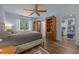 Spacious main bedroom featuring a ceiling fan, wood floors, and a closet at 5300 Langdon Dr, Oxford, NC 27565