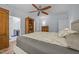 Comfortable main bedroom with light blue walls and an attached bathroom at 5300 Langdon Dr, Oxford, NC 27565