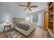 Well-lit main bedroom showcasing a window, bedside table, and hardwood flooring at 5300 Langdon Dr, Oxford, NC 27565