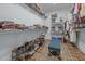 Organized walk-in closet featuring shelving, storage, and a plush cushioned ottoman at 5300 Langdon Dr, Oxford, NC 27565